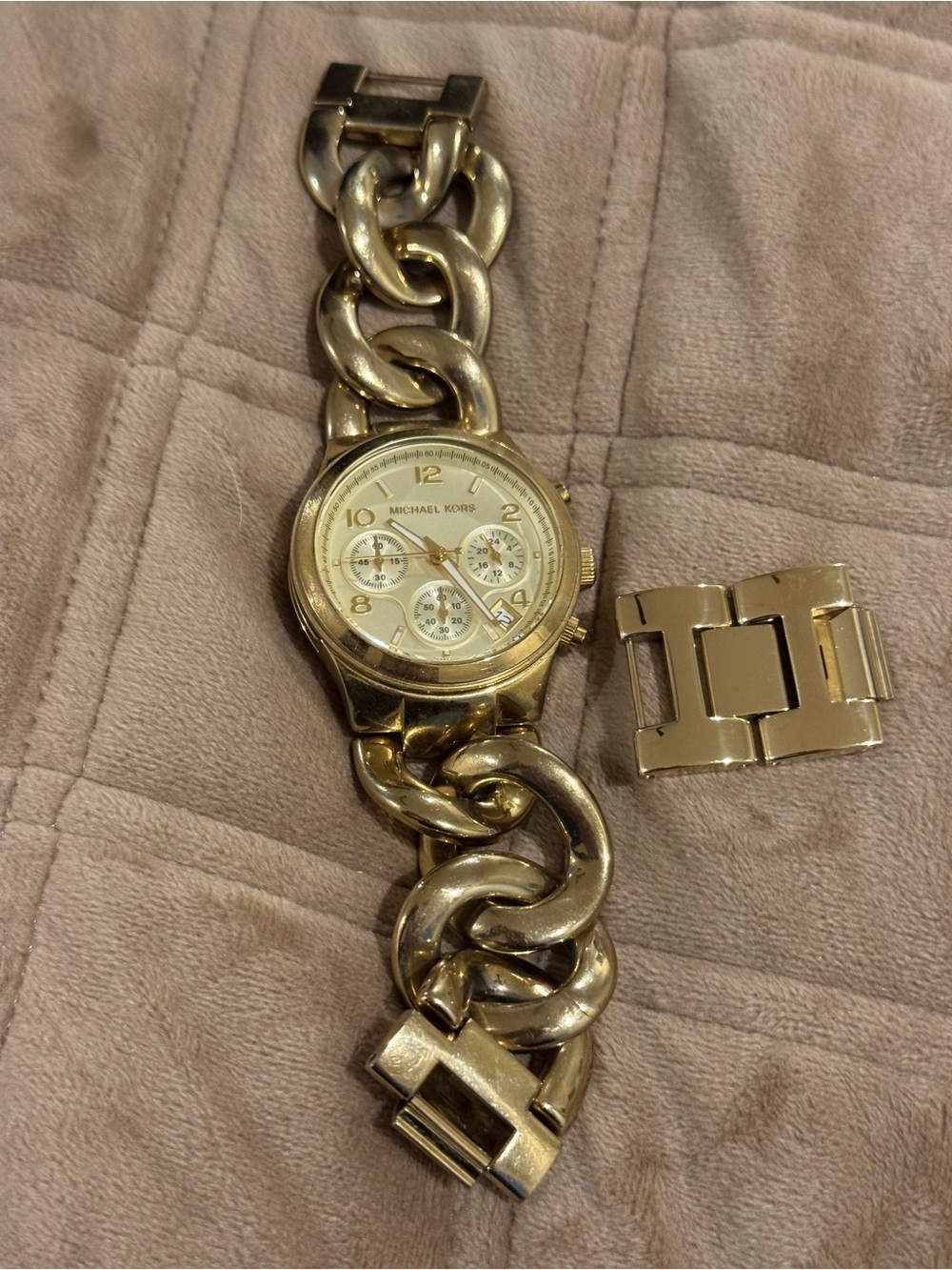Michael Kors Gold Tone Watch with links.